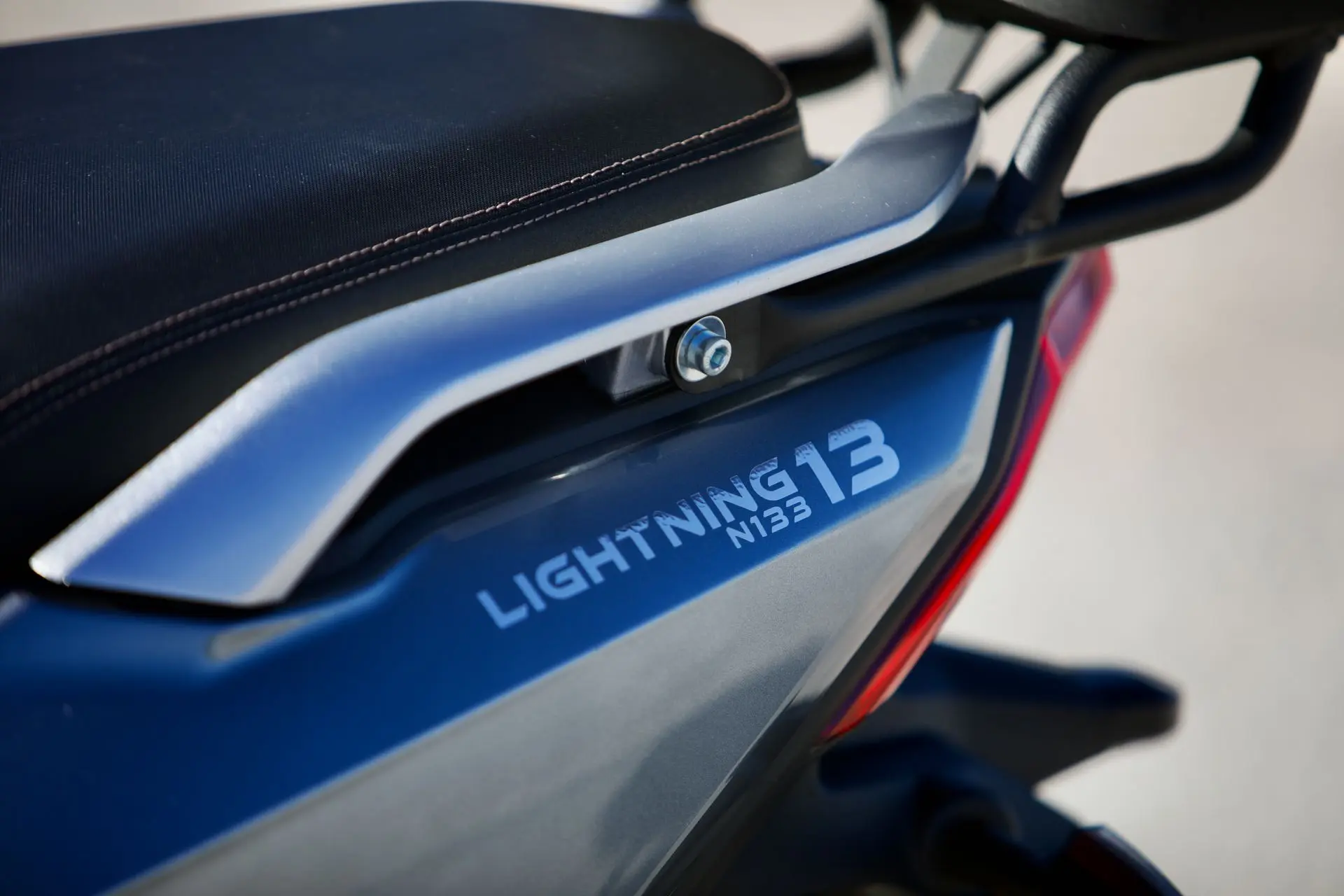 EWIZZ LIGHTNING Mk2 side panel with LIGHTNING 13 badge and grab rail